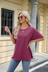 Outdoor shot of a purple loose-fit crewneck T-shirt with drop shoulder sleeves