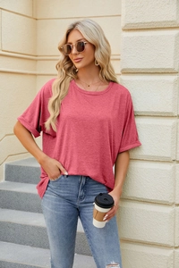 Close-up of rolled sleeve detail on women's rose pink knit cotton blend casual T-shirt