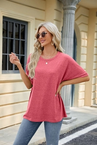 Detail of loose fit crew neck short sleeve t-shirt in dusty pink with heather texture