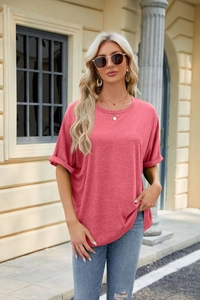 Detail of loose oversized round neck t-shirt with rolled sleeves in dusty rose pink