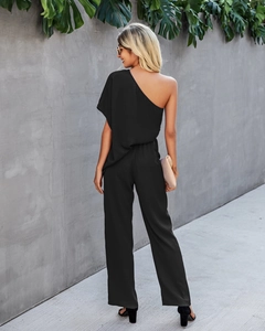 Detail of elegant black one-shoulder jumpsuit featuring a high waist and wide leg cut