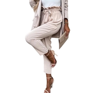 Elegant beige two-piece suit with double-breasted blazer and paperbag waist trousers