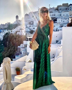 Close-up of emerald green pleated maxi dress with spaghetti straps in Santorini