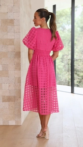 Rear view of rose pink lantern sleeve dress with checkered texture and elastic waist