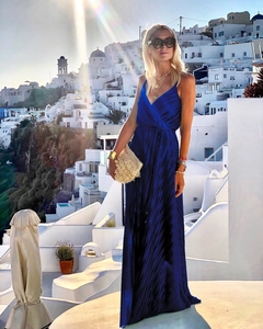 Detail of royal blue pleated maxi dress with deep V-neck and metallic silk finish
