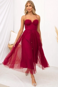 Detail of burgundy mesh midi dress with corset bodice, boning structure and tiered tulle skirt