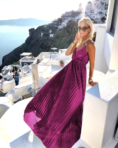 Detailed texture of pleated magenta maxi dress with metallic satin finish for summer