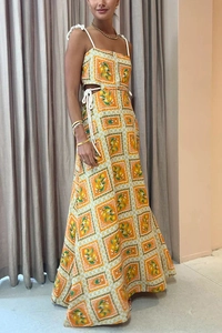 Detail of orange and white checkered dress with lemon patterns and cutout waist drawstring