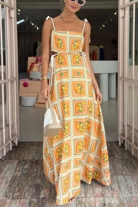 Detail of waist cut-out with white drawstring on orange lemon print maxi summer dress