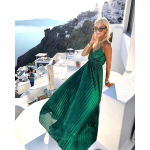 Elegant emerald green pleated maxi dress with spaghetti straps and a deep V-neckline