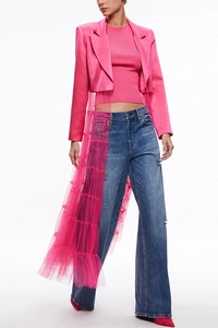 Detail of pink satin blazer with tiered tulle overlay and denim pants outfit