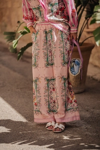 Detailed texture of pink floral print leisure set with high-waist wide-leg pants