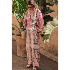 Women's pink floral two-piece set featuring long sleeve shirt and wide-leg pants