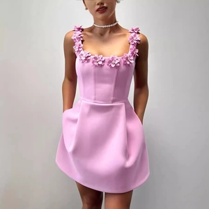 Sleeveless pink mini dress with 3D floral strap details and practical side pockets