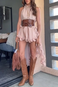 Detail shot of pink ruffle sleeveless mini dress with brown wide belt and western boots