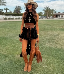 Detail view of a western-style tiered skirt set with an embossed brown leather waist corset