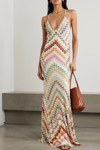 Detail of colorful zigzag print dress with slim fit knit texture and deep V-neckline