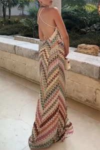 Detailed back view of a colorful crochet knit dress with zigzag patterns and crisscross straps