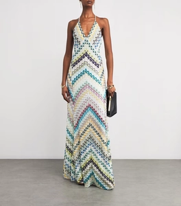 Detail of elegant V-neck halter dress featuring colorful chevron knit patterns and texture