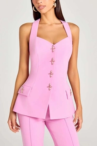 Detail view of pink vest heart-shaped neckline with golden floral decorative buttons