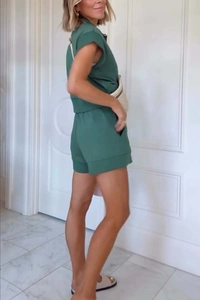 Detail view of dark green short sleeve tracksuit set with side pockets and casual fit