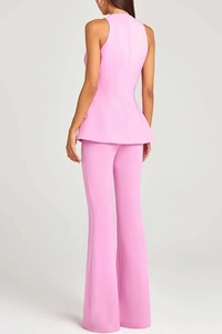 Rear view of light pink sleeveless peplum top and matching flared suit pants for women