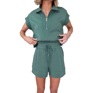 Women's two-piece lounge set with short sleeve zip-up sweatshirt and drawstring shorts in sage green
