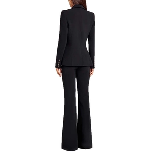 Back view of women's black slim fit blazer suit set with gold buttons and flared pants