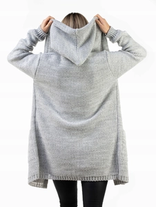 Close-up of the textured rib knit fabric and oversized hood on a gray winter cardigan