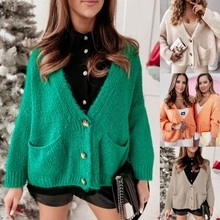 Detailed close-up showing vibrant green knit texture and functional side slit on sweater