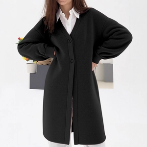 Long oversized black knit cardigan with V-neck, buttons and lantern sleeves for women