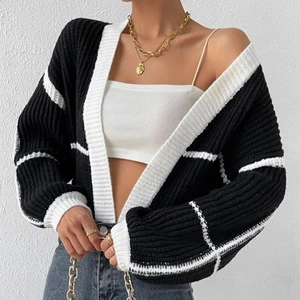Women's black and white chunky knit cardigan with relaxed fit and stylish pattern design