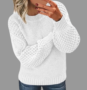 Detailed close-up showing the rich honeycomb knit texture of a white crew neck sweater