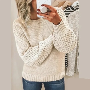 Detail of oat beige chunky knit sweater with lantern sleeves and ribbed cuffs