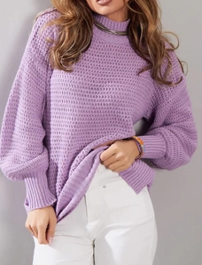 Detail of purple waffle knit sweater featuring split hem and textured turtleneck design