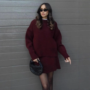 Deep burgundy knit set featuring a crewneck sweater and matching skirt for women
