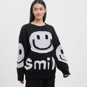 Retro oversized black smile sweater with white smiley graphic and soft knit fabric for women