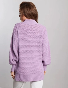 Close-up of lavender chunky knit sweater showing high collar and back texture details