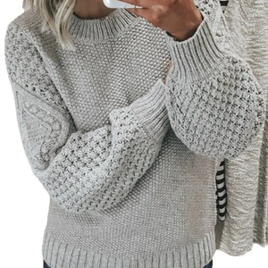 Chunky grey honeycomb knit sweater with diamond-patterned sleeves and ribbed round neck