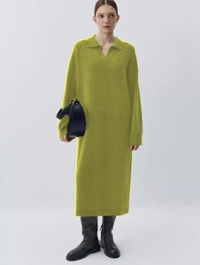 Detailed knit texture of an olive green long sleeve polo collar maxi sweater dress