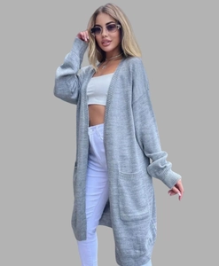 Detail view of a long grey knitted cardigan featuring large functional side pockets
