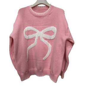 Pink oversized bow knit sweater with white striped ribbed edges for winter wear
