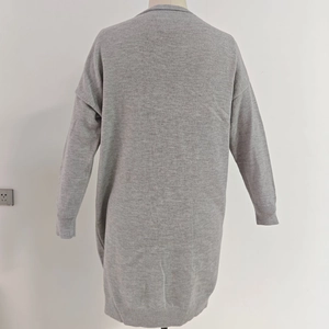 Rear view of a light gray long-sleeved knitted cardigan with ribbed cuffs and hem detail