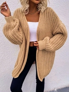 Detailed view of camel chunky knit cardigan with ribbed texture and balloon sleeves