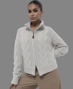 Detail of off-white cable knit alpaca wool cardigan with double zipper closure