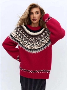 Detailed view of red Fair Isle knit sweater featuring classic jacquard collar patterns