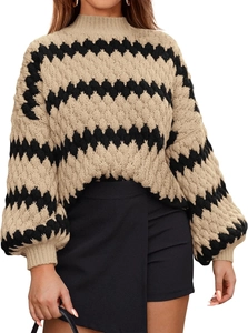 Detailed close-up of thick beige and black wavy knit pattern on oversized sweater sleeves