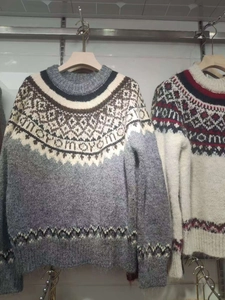 Detail of vintage Fair Isle knit sweater showing soft mohair texture and geometric patterns
