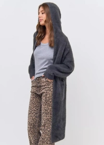 Close-up of fluffy dark grey faux mink knit cardigan with long hood and soft texture