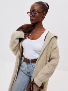 Detailed texture of beige long-sleeve plush faux mink cardigan with soft fuzzy fabric